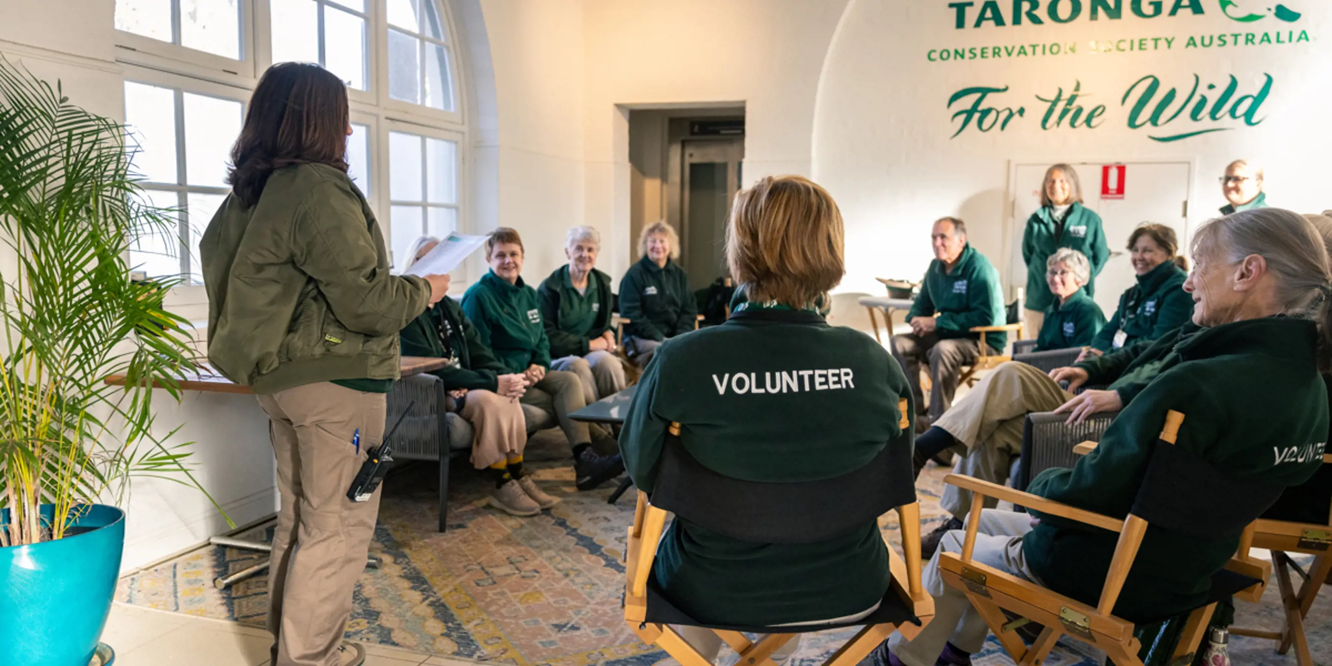 Group of Guest Experience Volunteers in briefing session